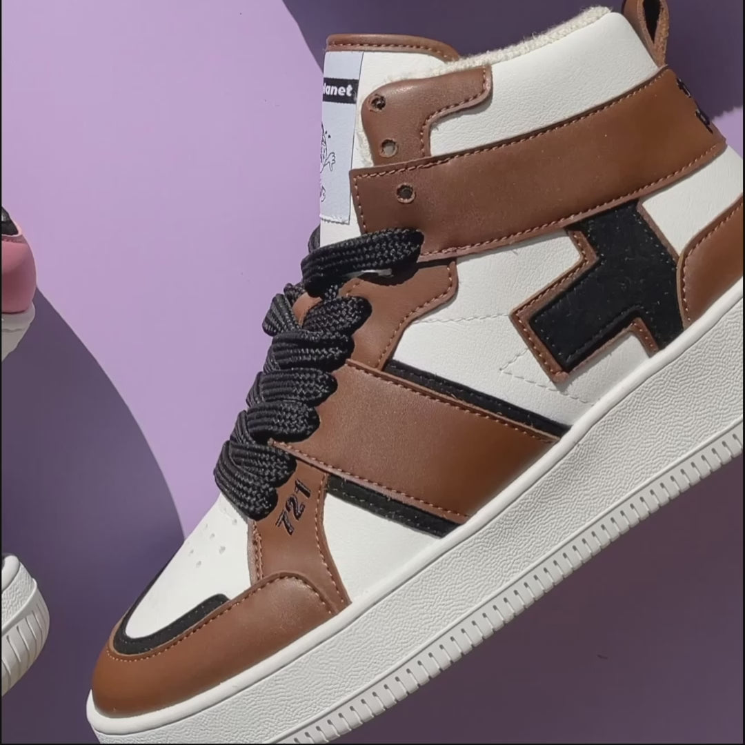 Looped video zooming into the details of an ethically made brown, black, and white vegan high-top sneaker by Trash Planet
